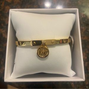 Gold Michael Kors bracelet with tag